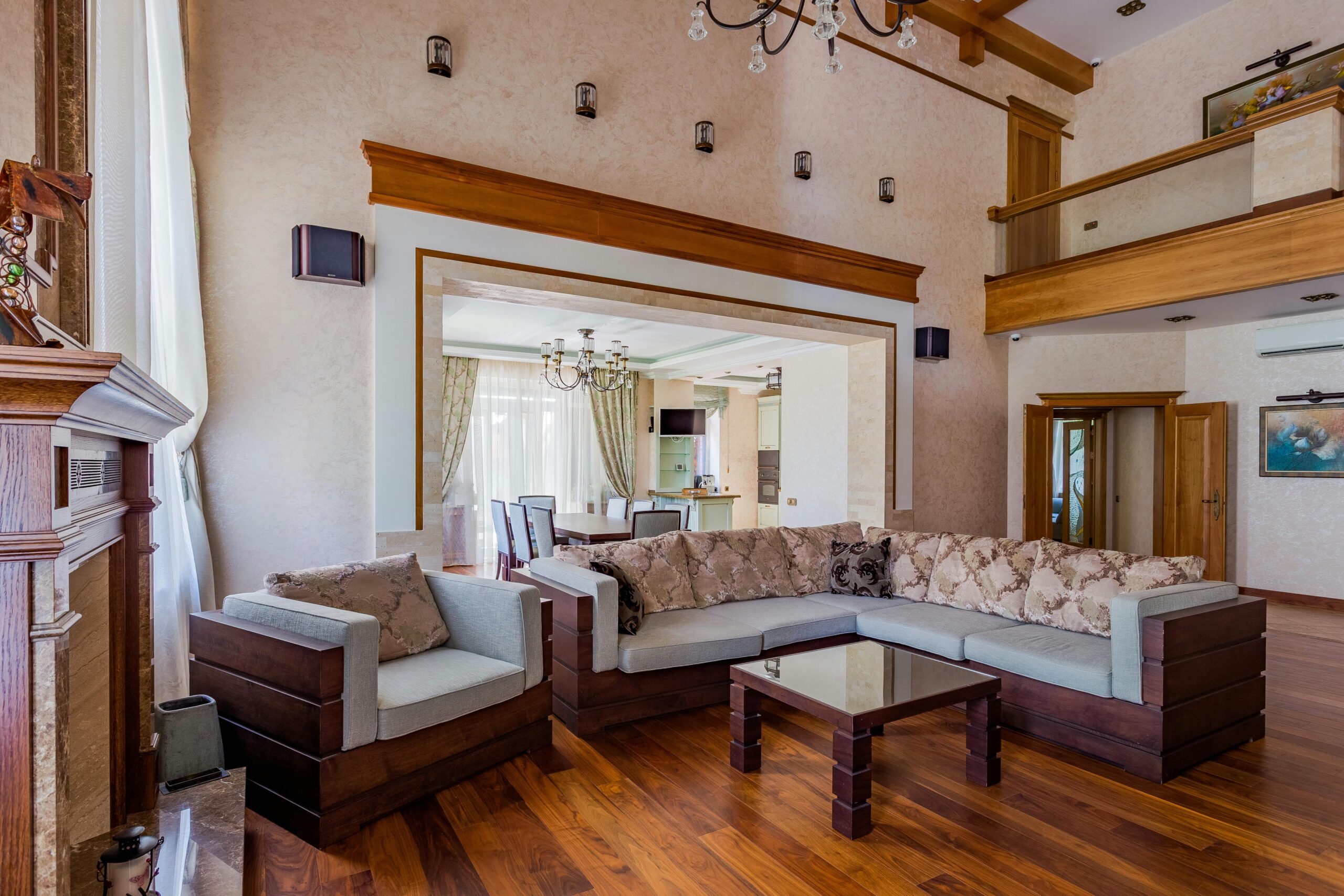 Luxurious living room featuring a large sectional sofa and elegant decor.